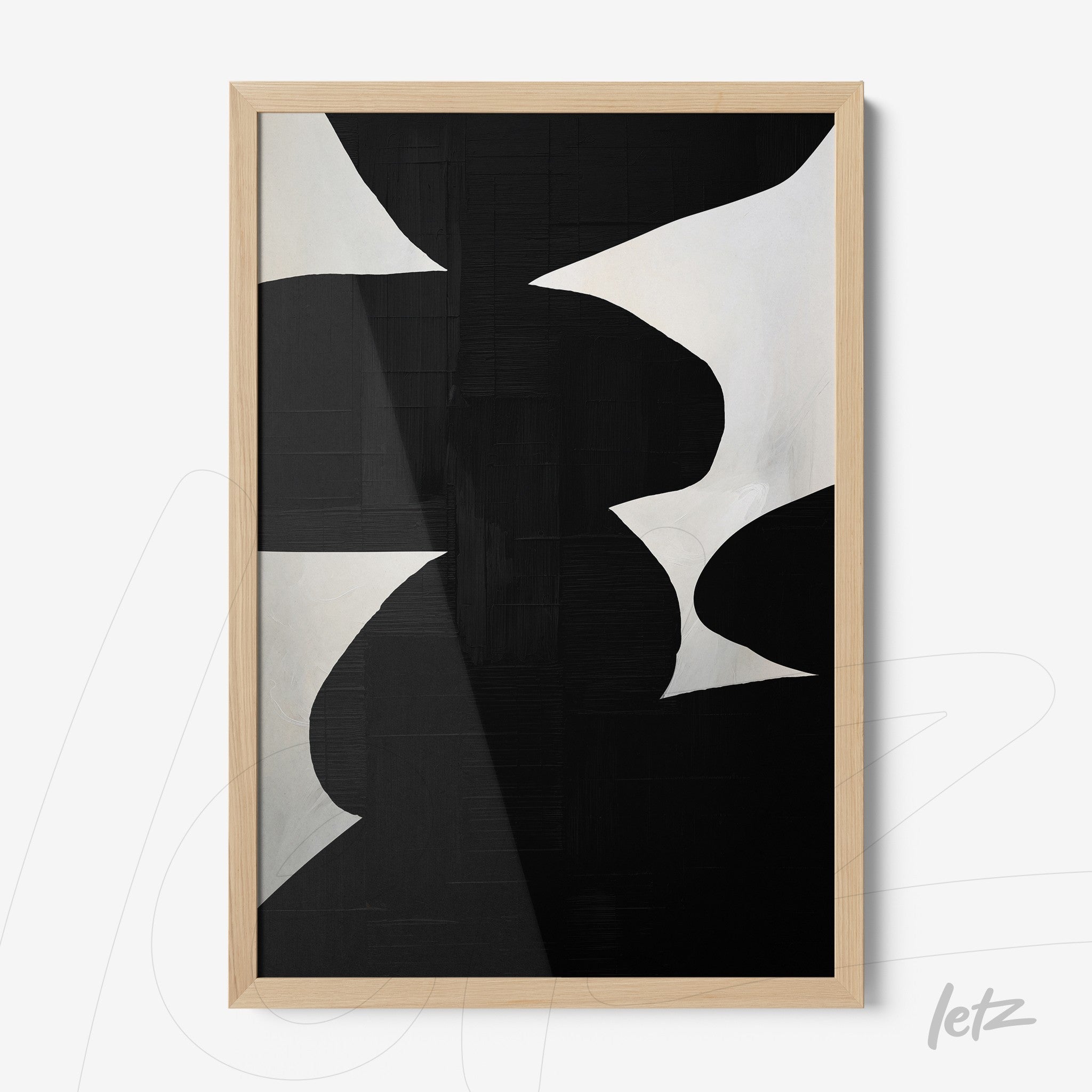 abstract black and white wall art in light wood frame