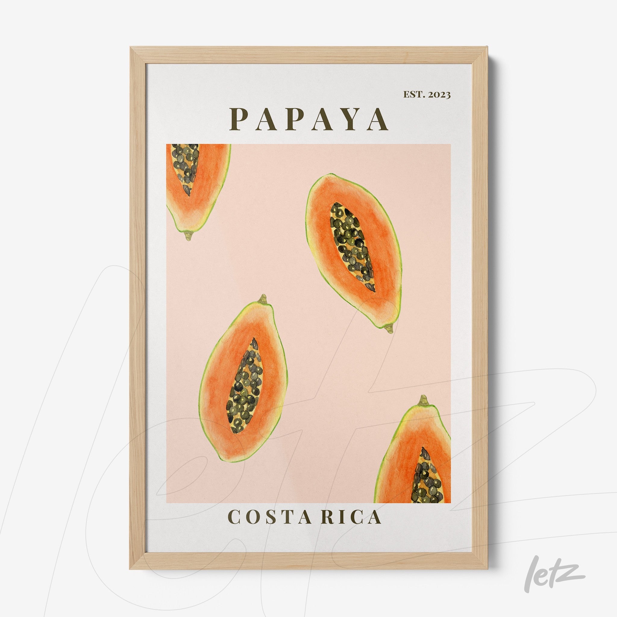 framed wall art featuring papaya illustration on light pink background with light wood frame