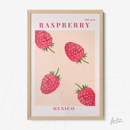 framed wall art featuring raspberries with a light wood frame and pink background