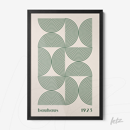 framed wall art with bauhaus style geometric design of green concentric circles and black frame