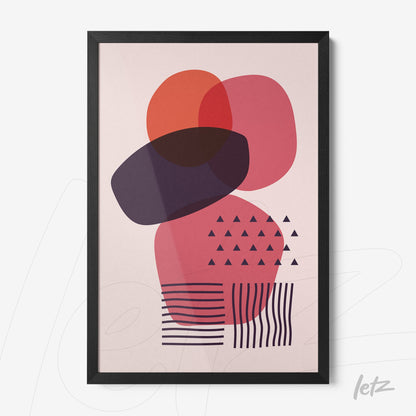 black framed abstract art with geometric shapes in red and purple hues