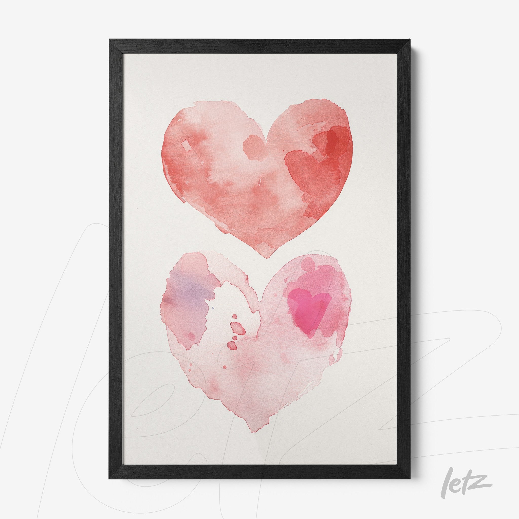 framed watercolor art depicting two hearts in shades of pink and red with a black frame