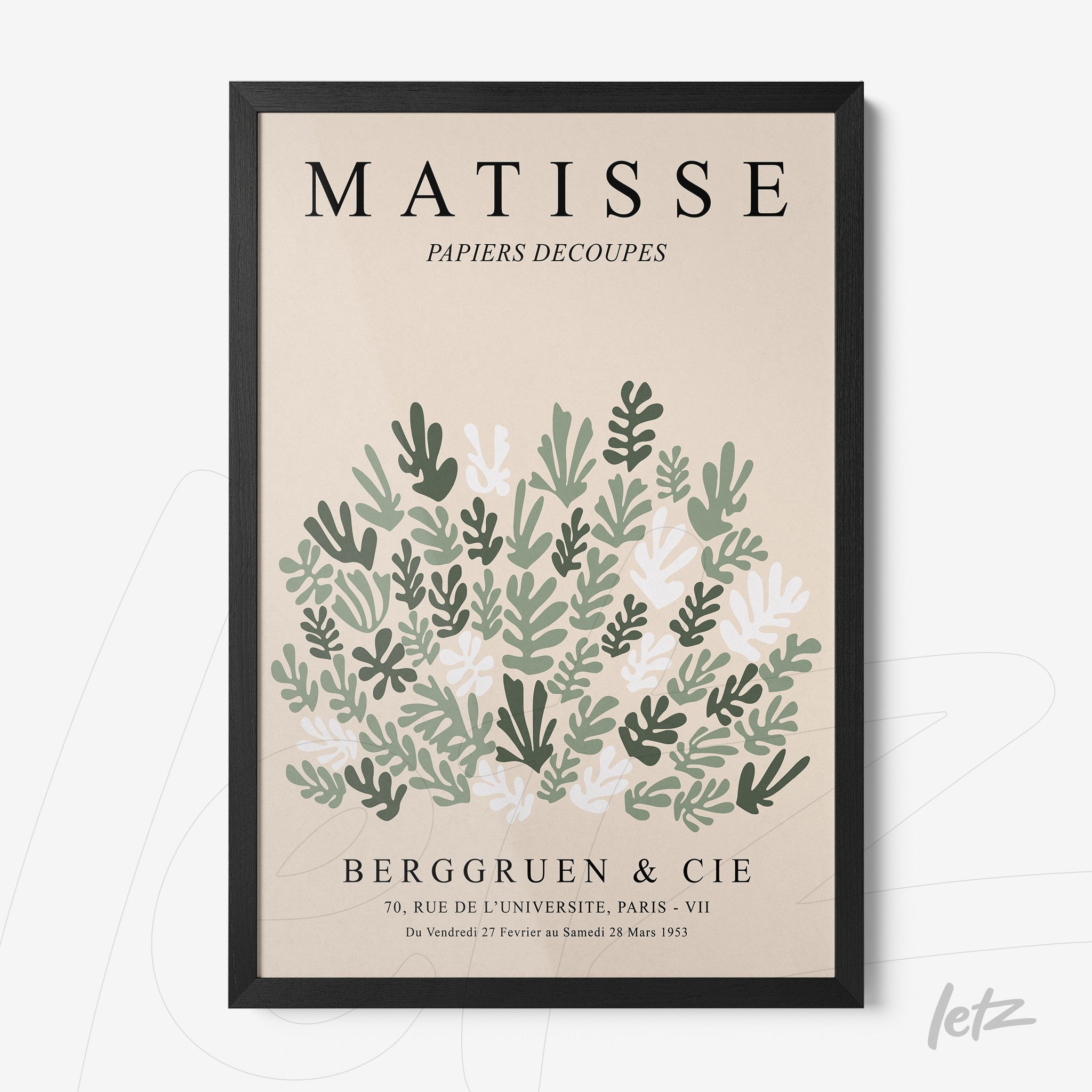 framed modern art featuring green and white leaves in a black frame