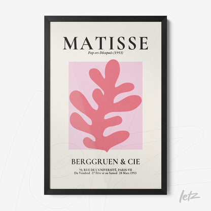 framed modern art piece showcasing pink leaves on a light background with black frame