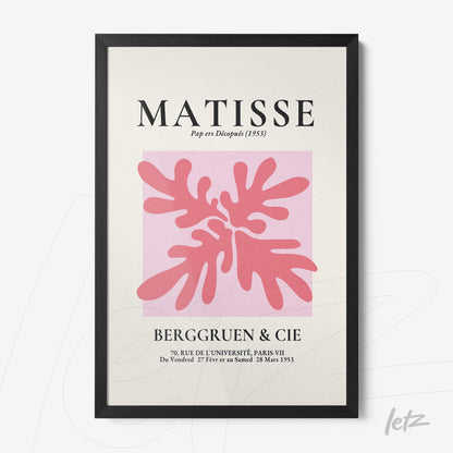 framed modern art featuring organic shapes in pink tones on a pastel background with black frame