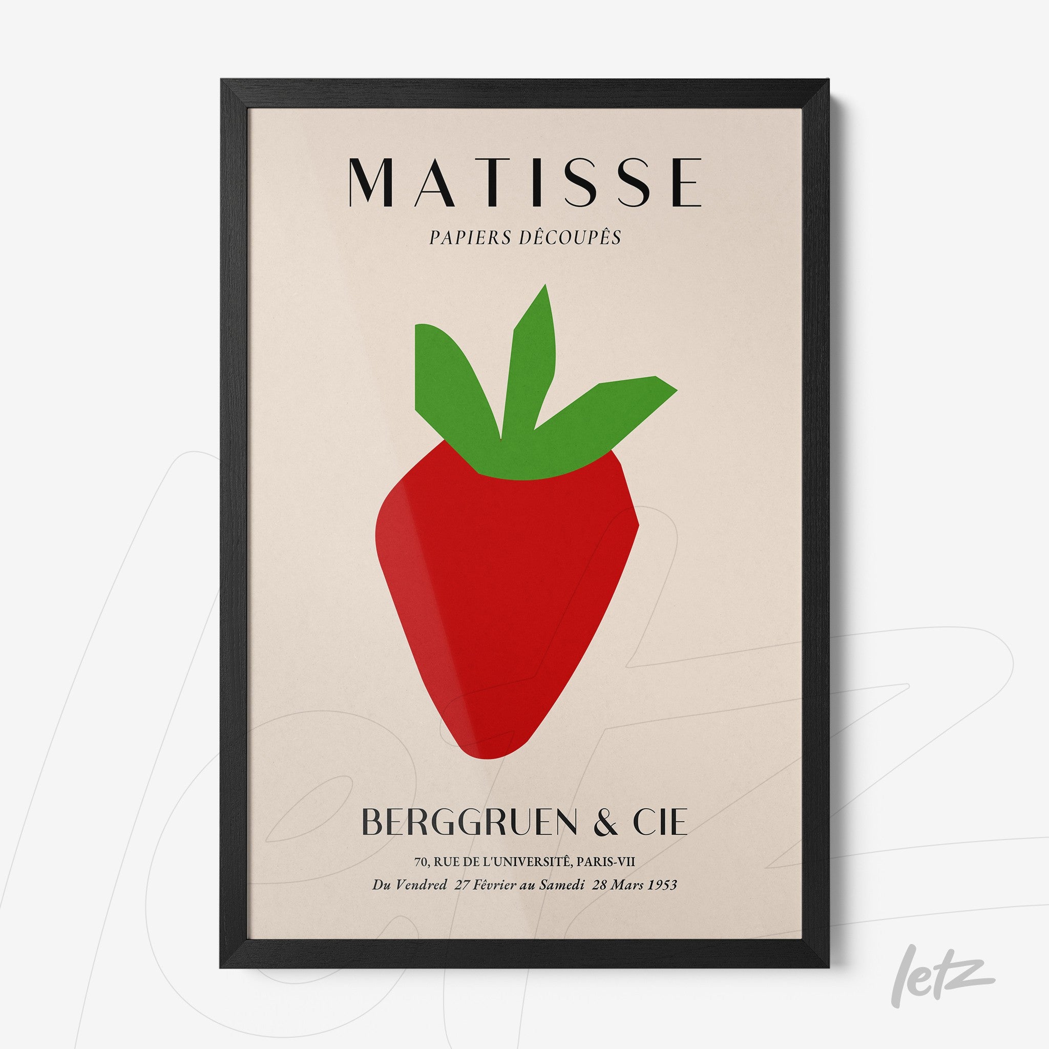 framed wall art featuring a modern print of a stylized strawberry on a neutral background with a black frame