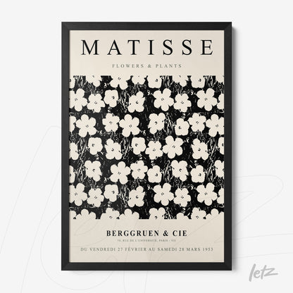 framed artwork inspired by Matisse featuring white flowers on a black background with a black frame