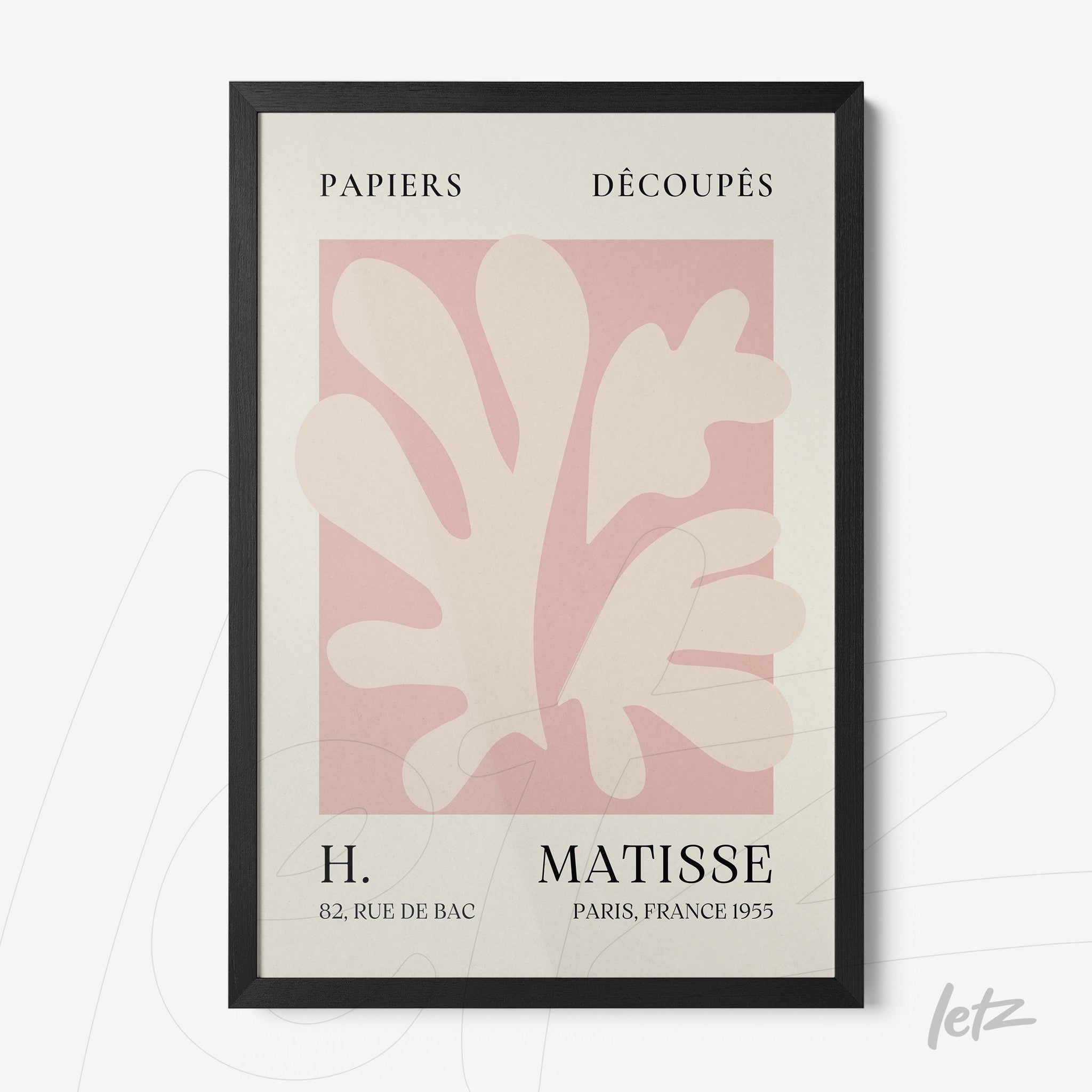 framed wall art featuring abstract shapes in pink and white with black lettering