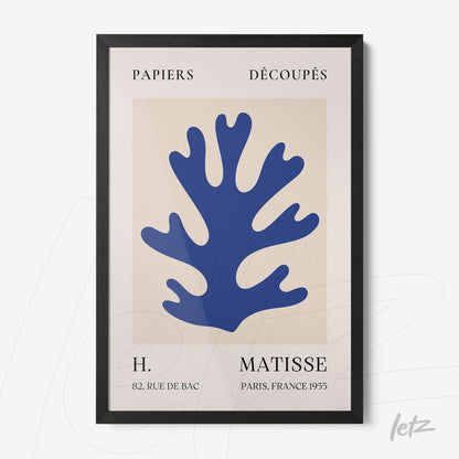 framed modern art featuring a blue coral shape on a light background with sleek black frame