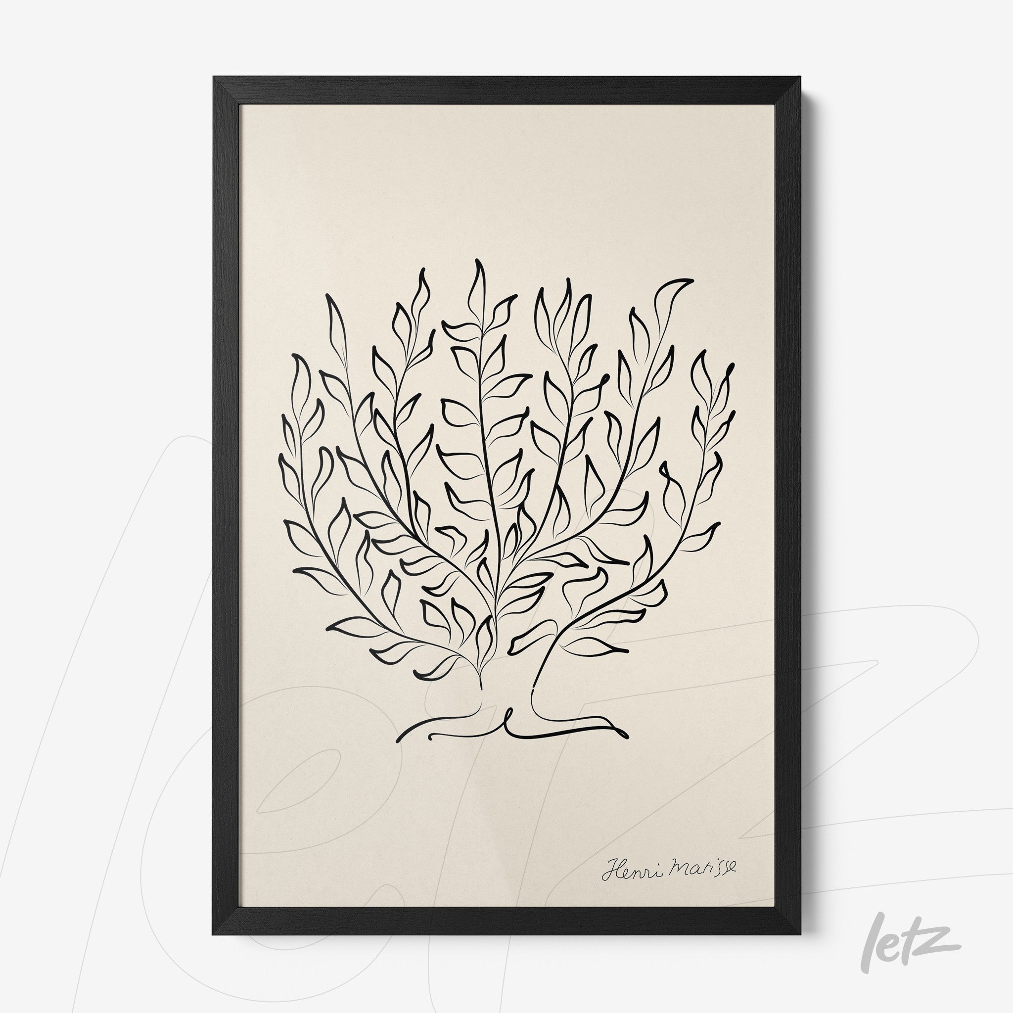 framed wall art featuring a minimalist illustration of leaves in black lines on a light background