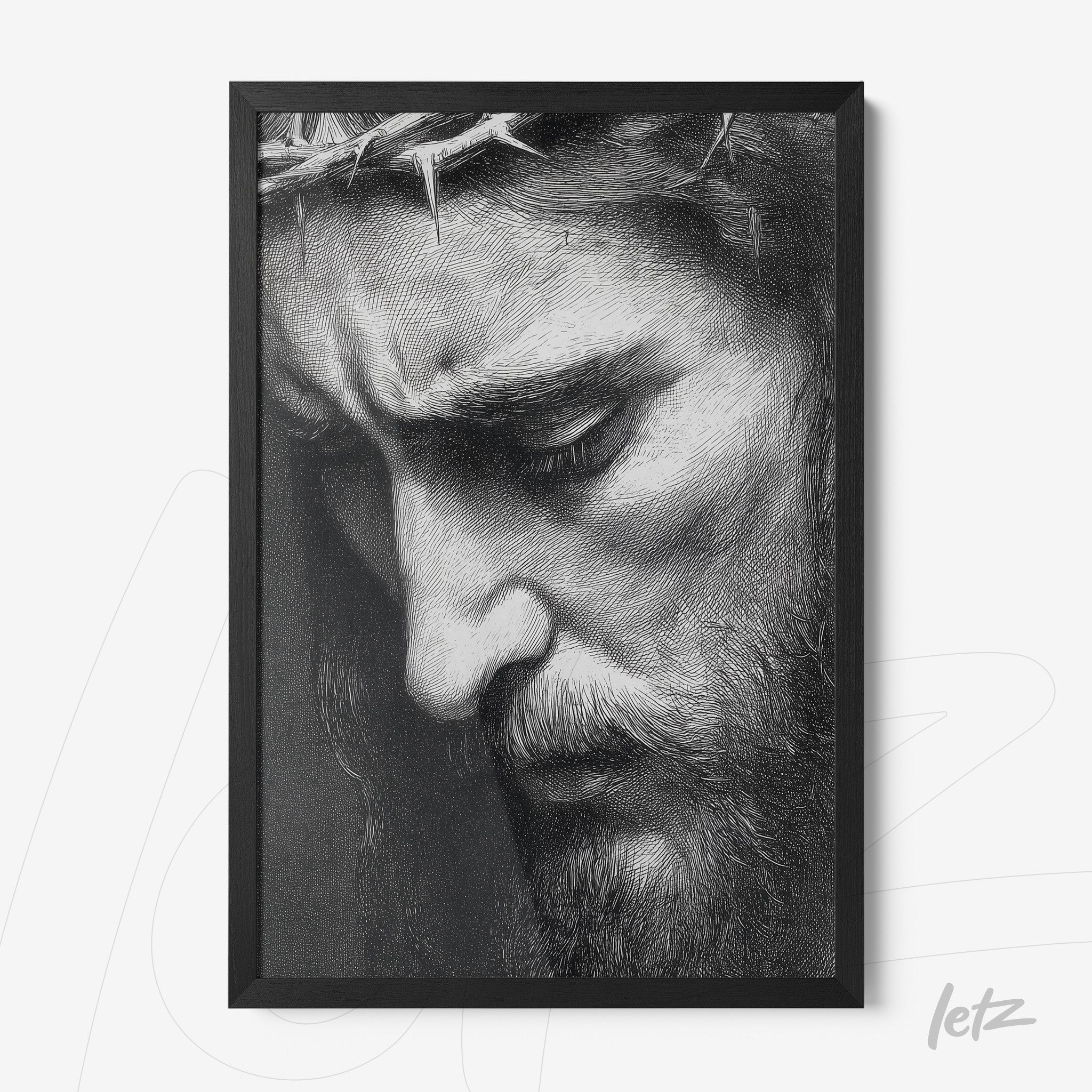 framed artwork featuring a black and white portrait of Jesus with a crown of thorns