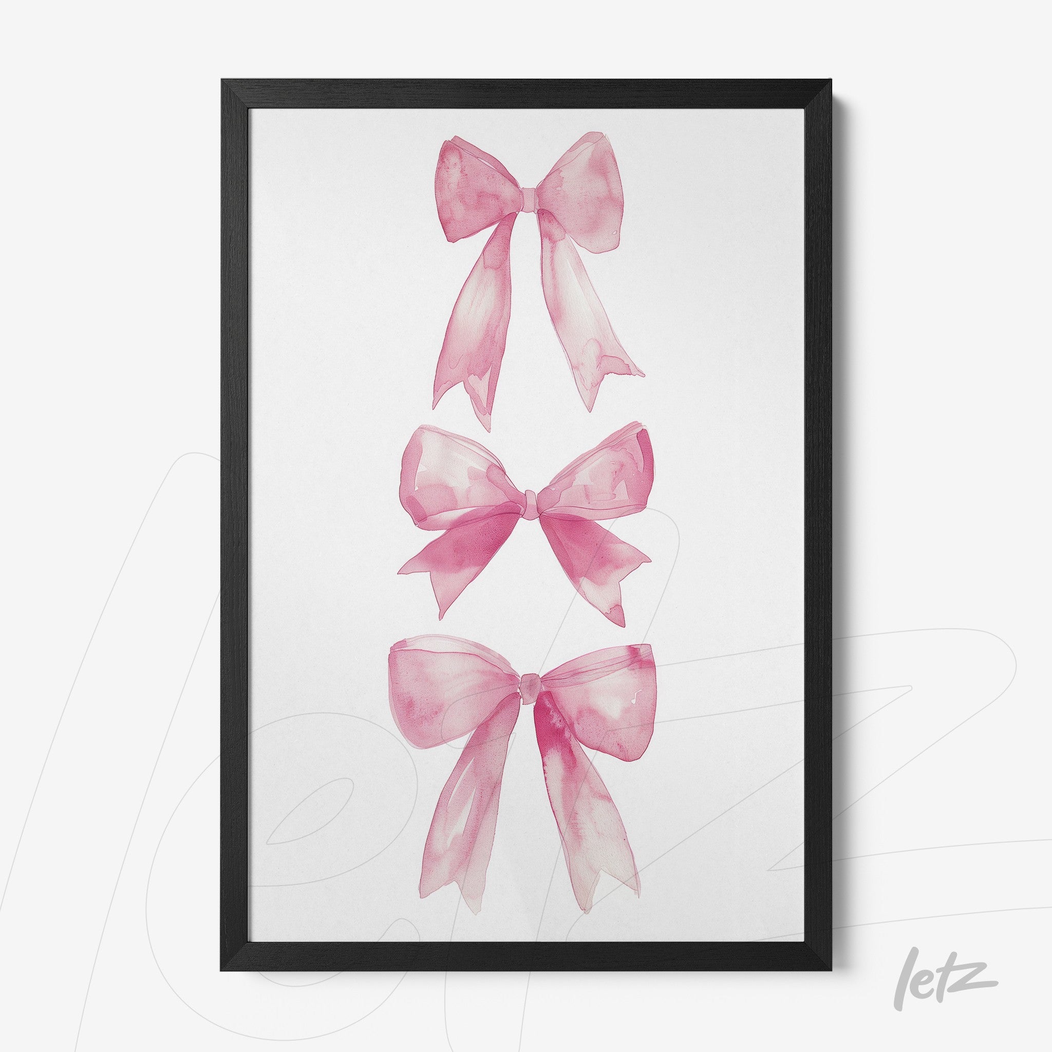 framed artwork featuring three pink watercolor bows with a black frame