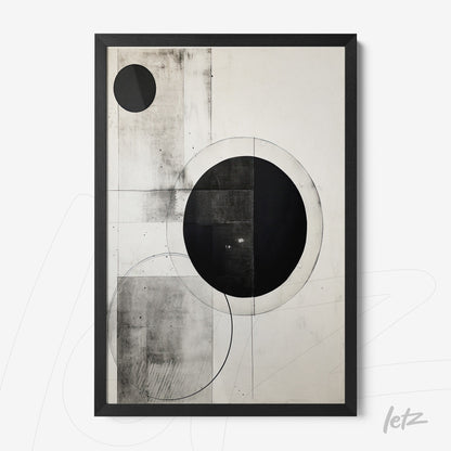 abstract wall art in black and white featuring circular geometric shapes in contrast with a black frame