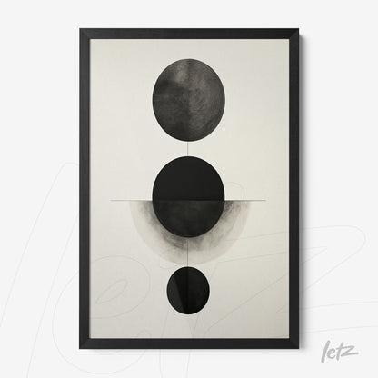 framed abstract wall art in black and white featuring circles on a light background with black frame
