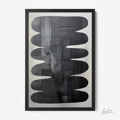 abstract wall art in shades of black and gray, framed in a matte black frame