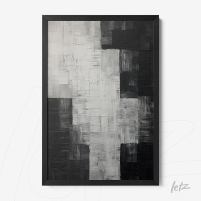 abstract wall art in black, white, and gray with textured brush strokes and black frame