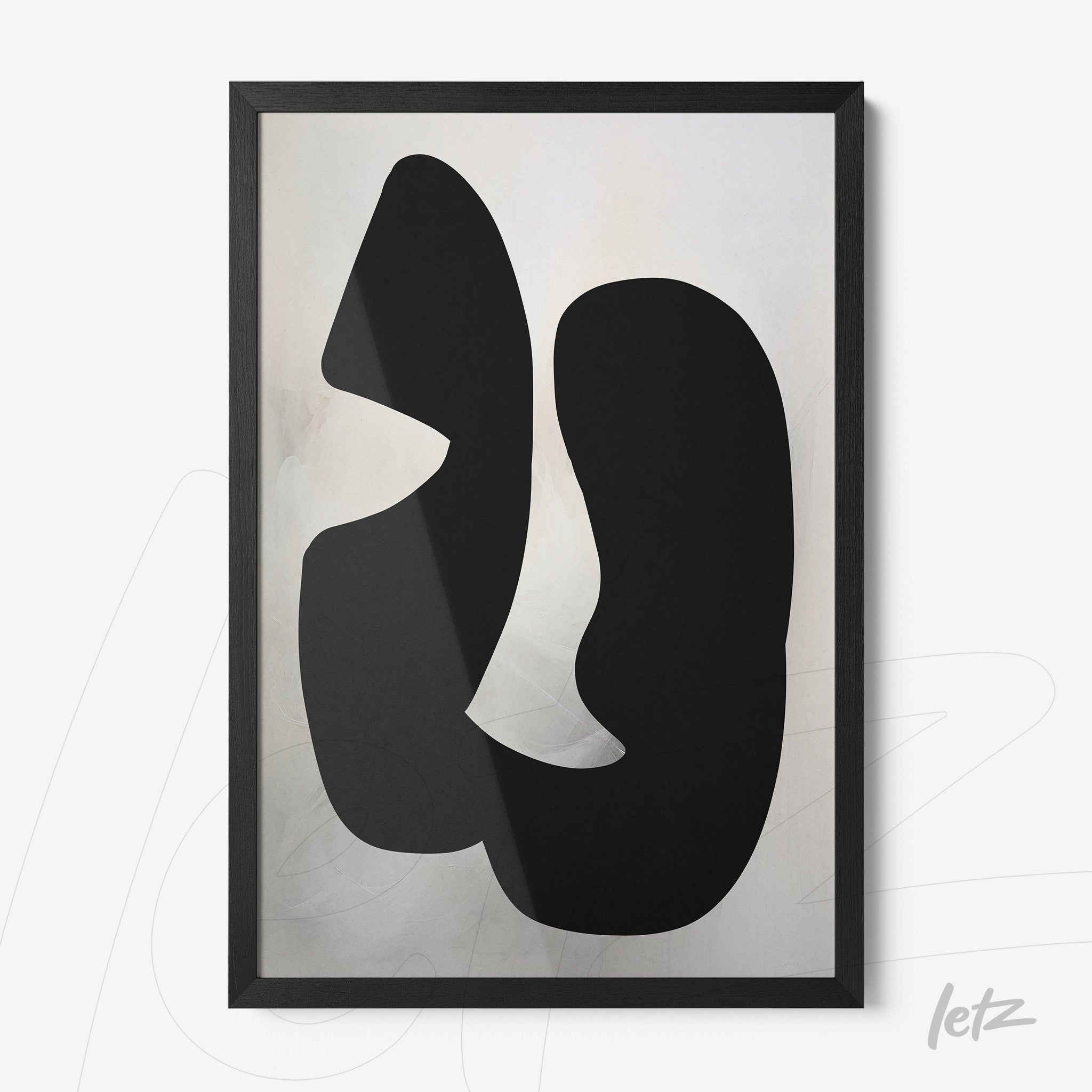 framed wall art featuring black abstract organic shapes on a light background