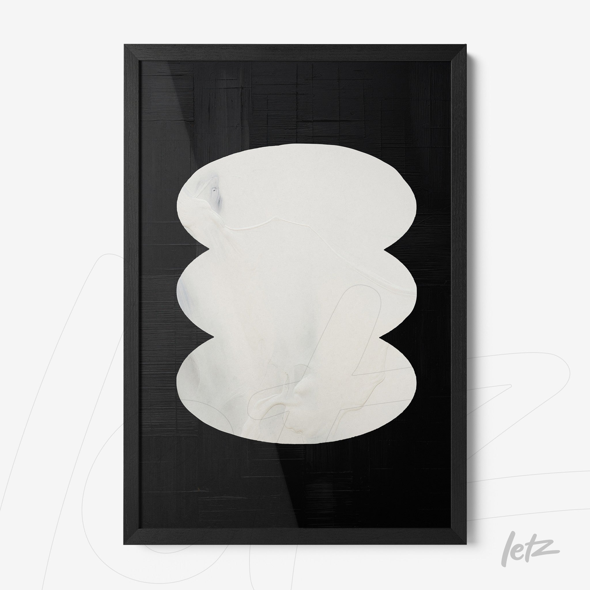 framed abstract art in light tones on black background with thin black frame