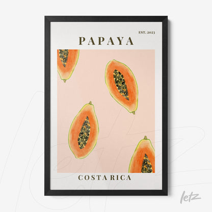 framed wall art featuring sliced papayas on a pink background