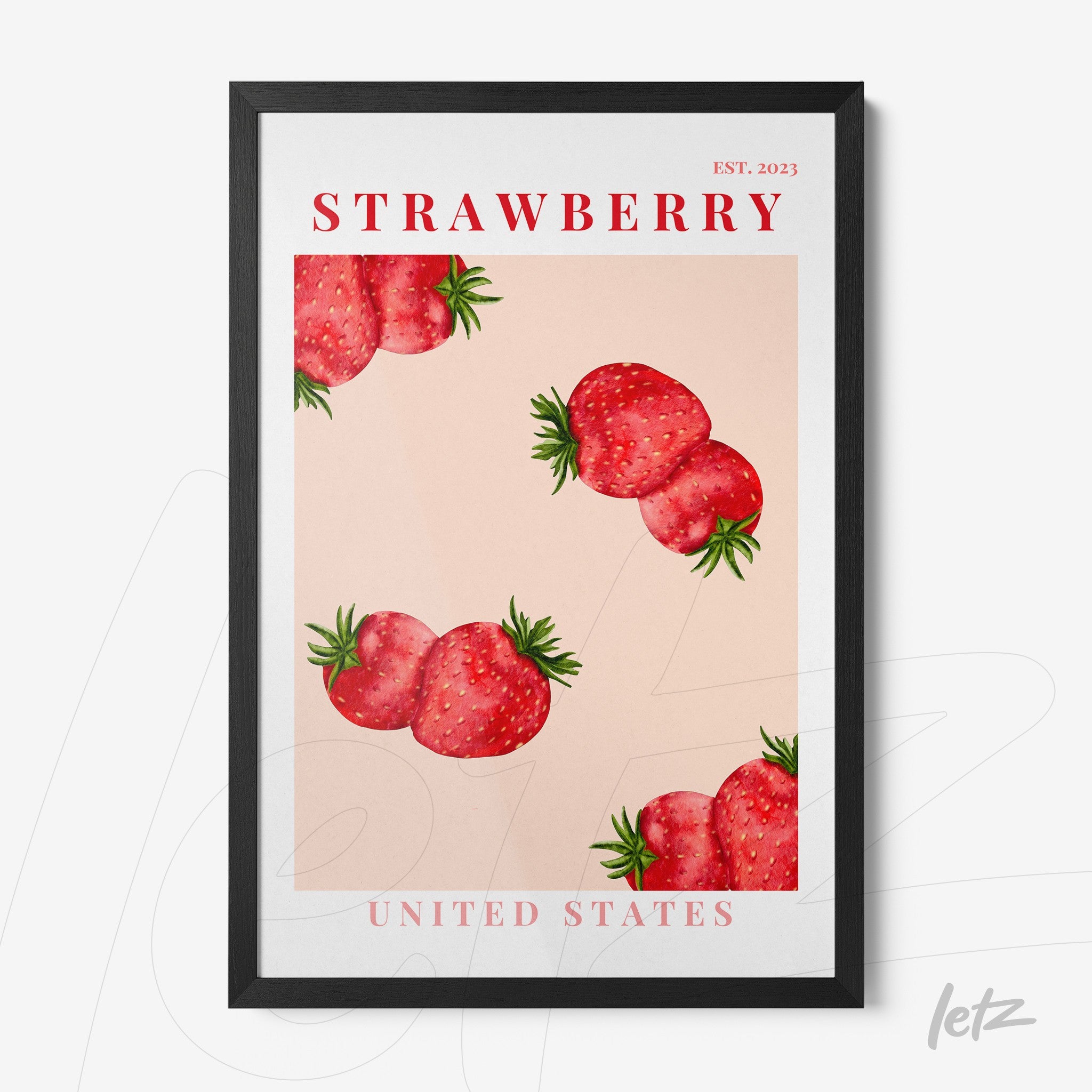 framed art print featuring strawberries on a pink background with black frame