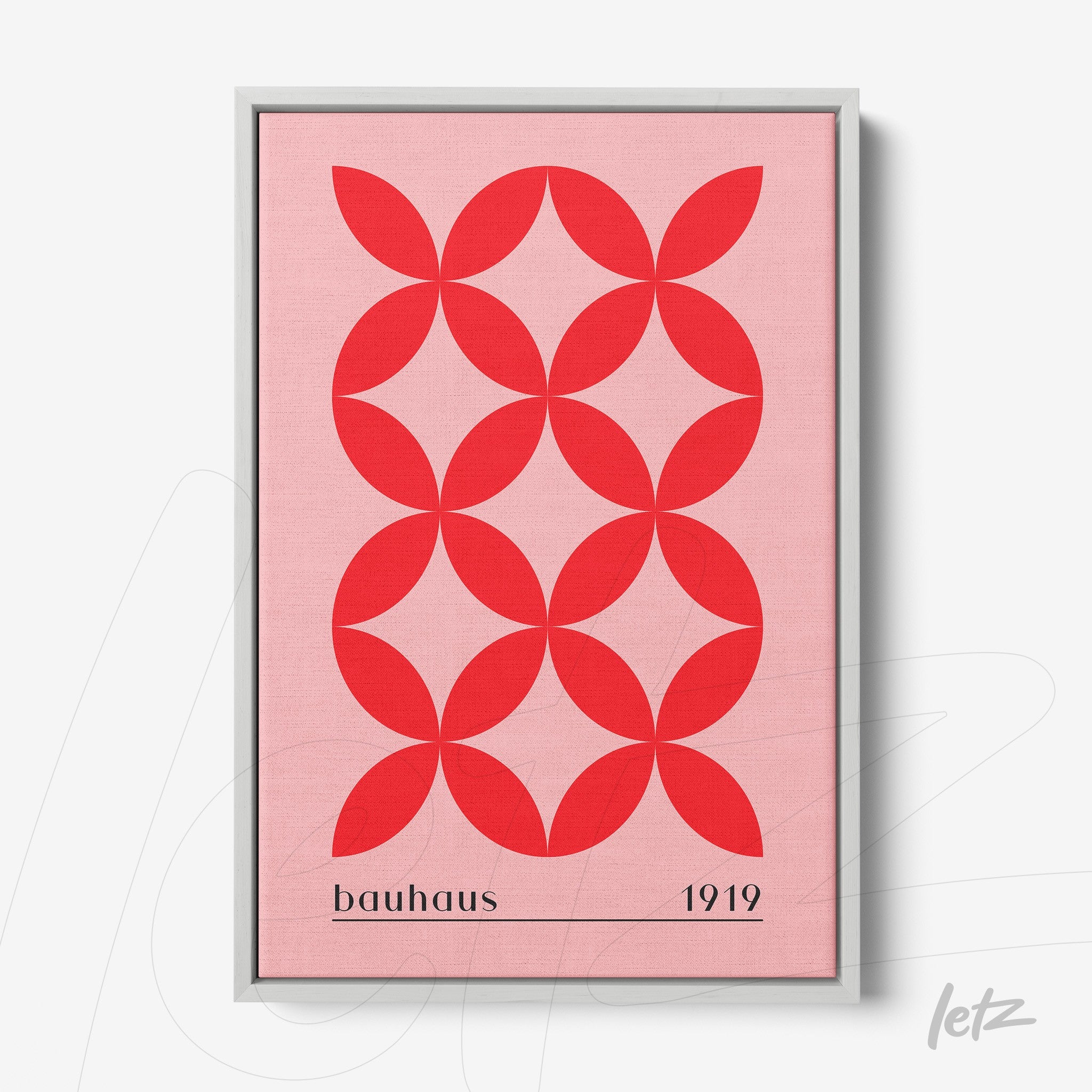 framed geometric art with repetitive red circles pattern on pink background, gray frame