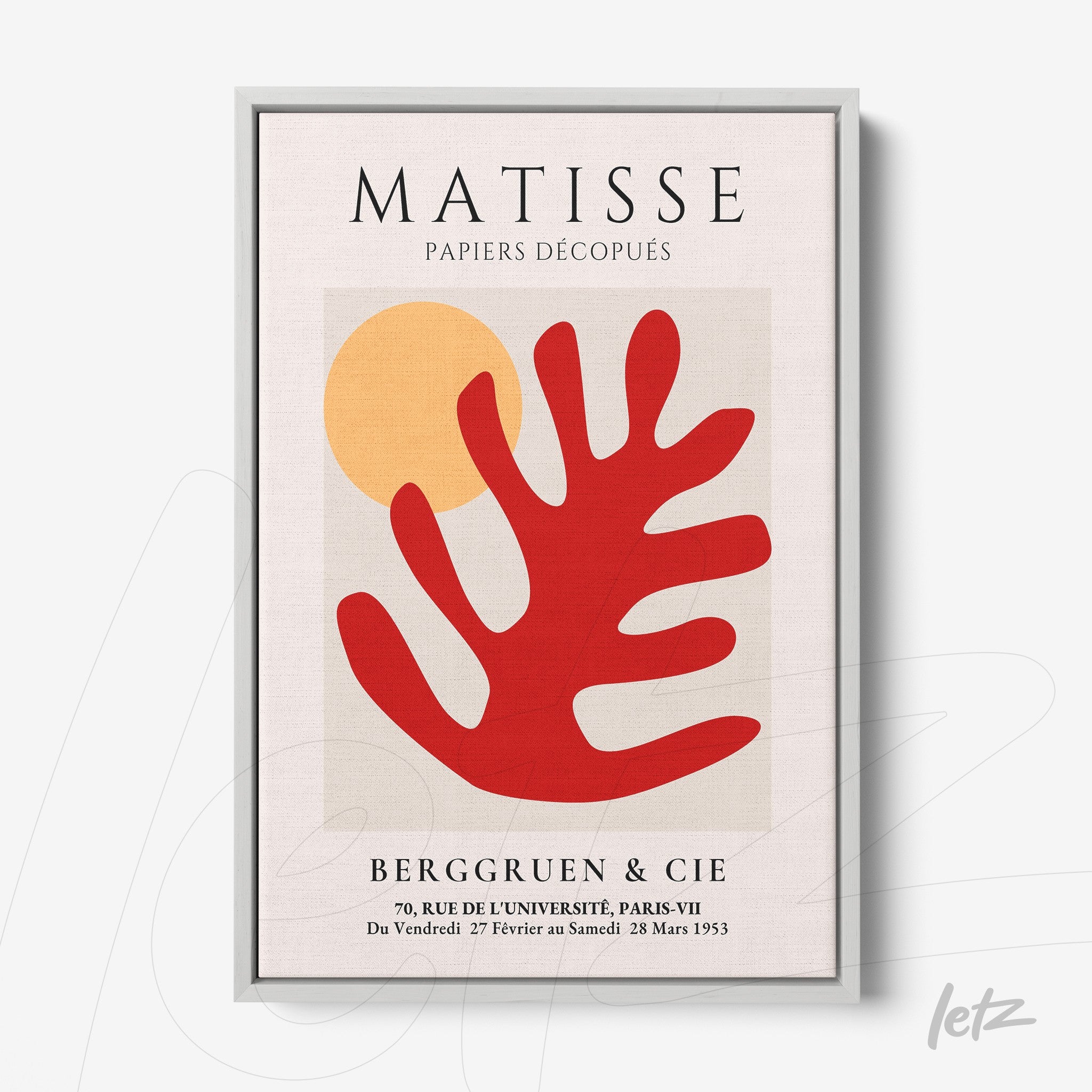 framed wall art featuring modern design of a red leaf shape and yellow circle with a silver frame