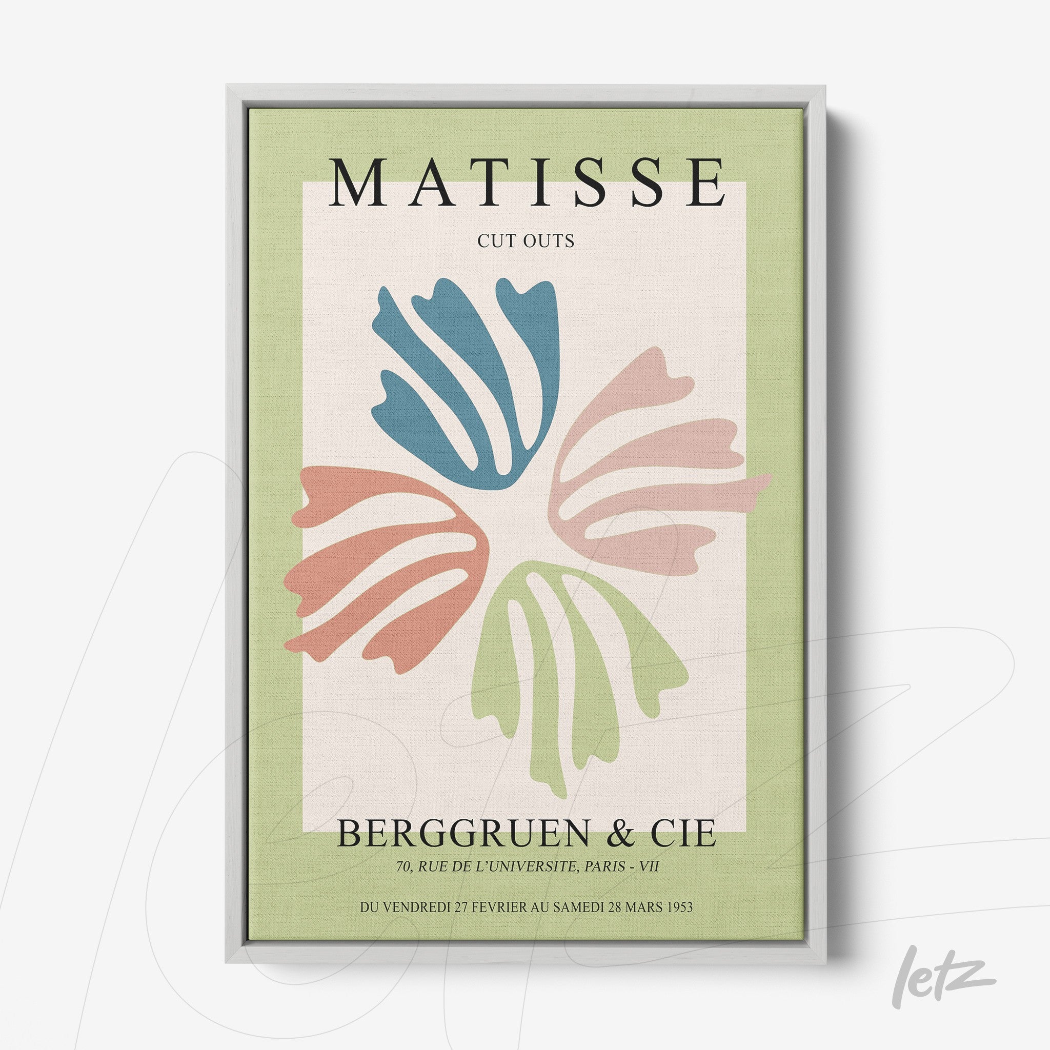 framed modern art featuring cutouts of leaves in light green background with silver frame