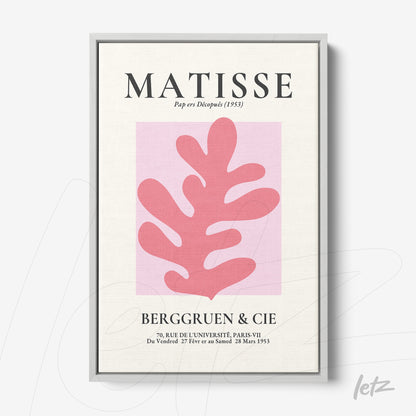 framed modern art inspired by Matisse featuring a pink leaf design on light pink background with silver frame