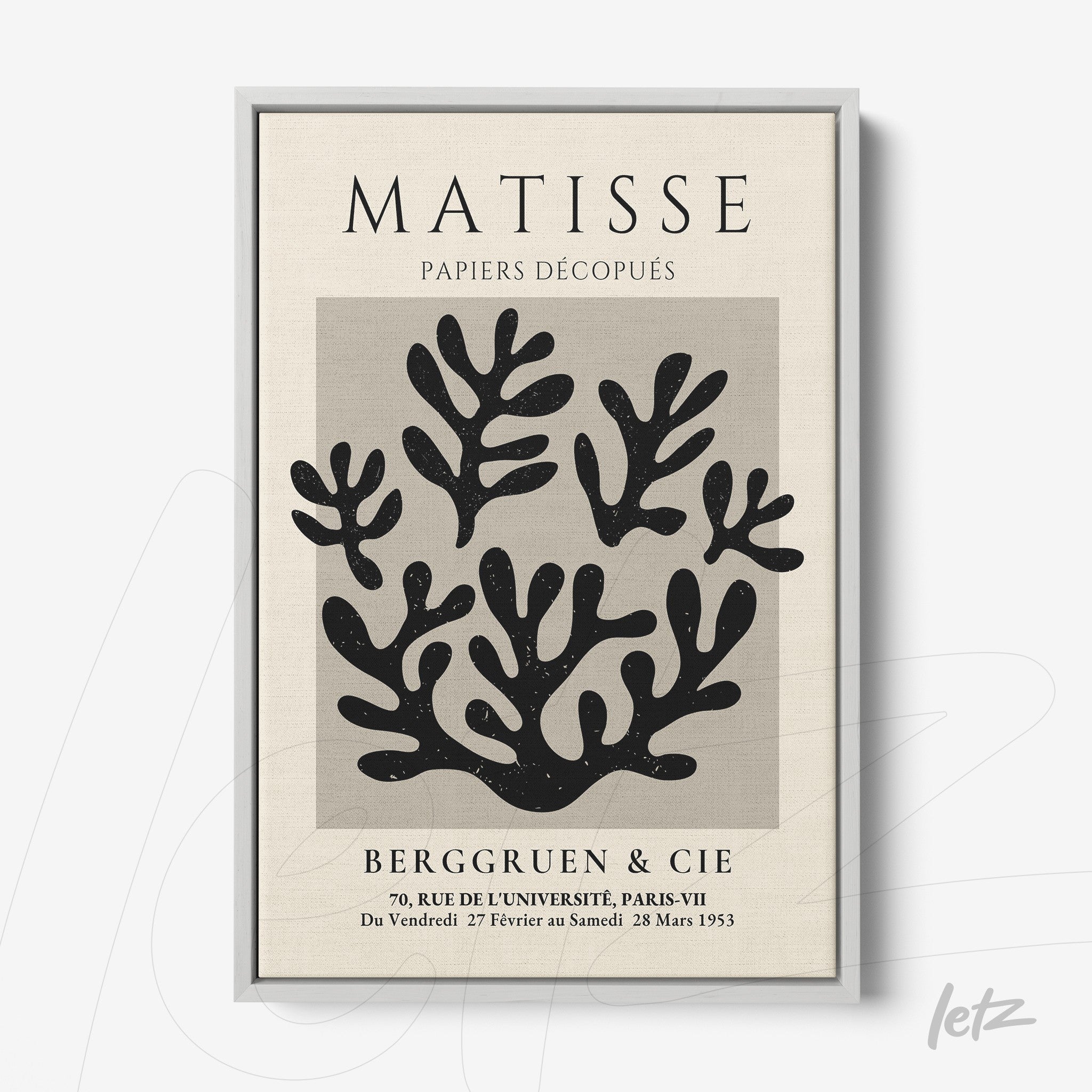 framed wall art featuring paper cut-out design in black on light background with silver frame and bold title