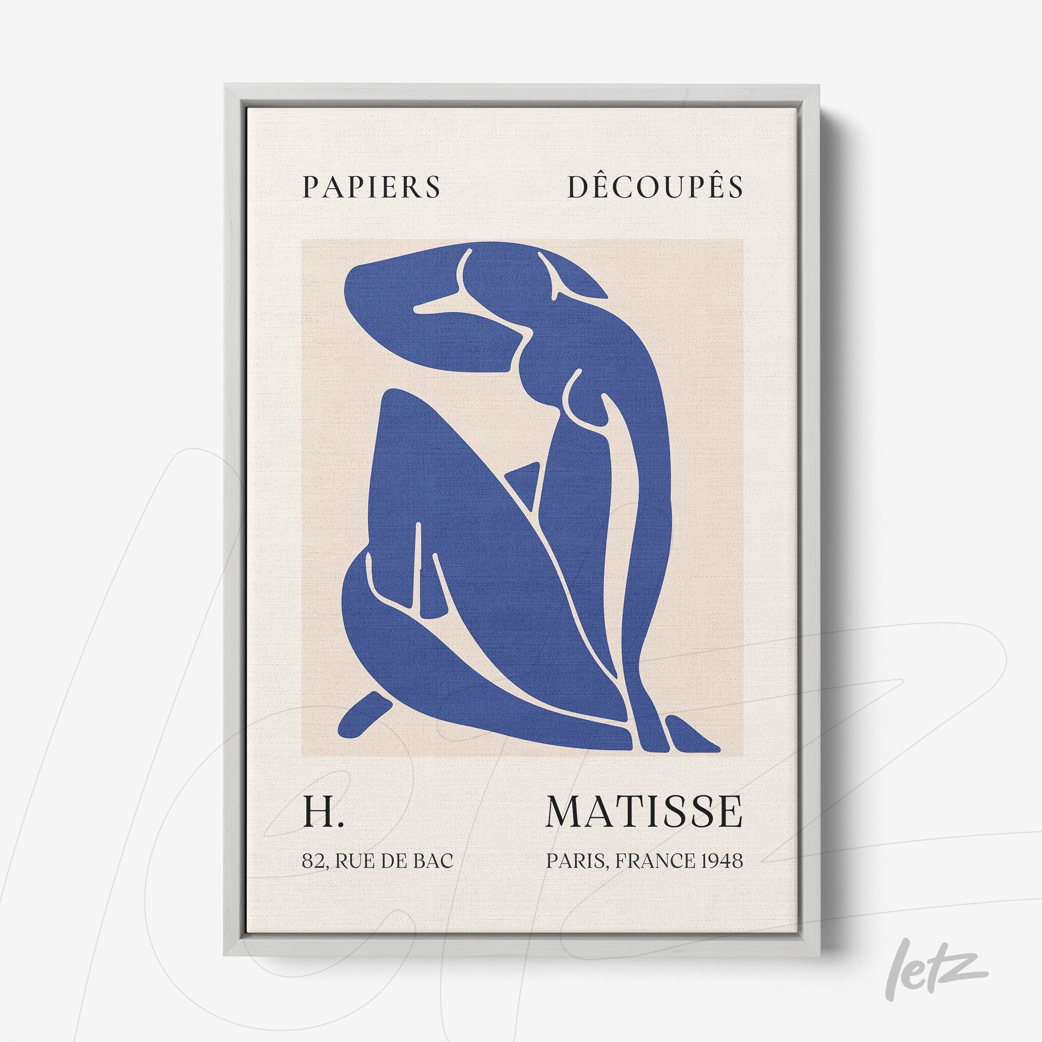 framed wall art featuring a blue cut-out figure against a neutral background with a light gray frame