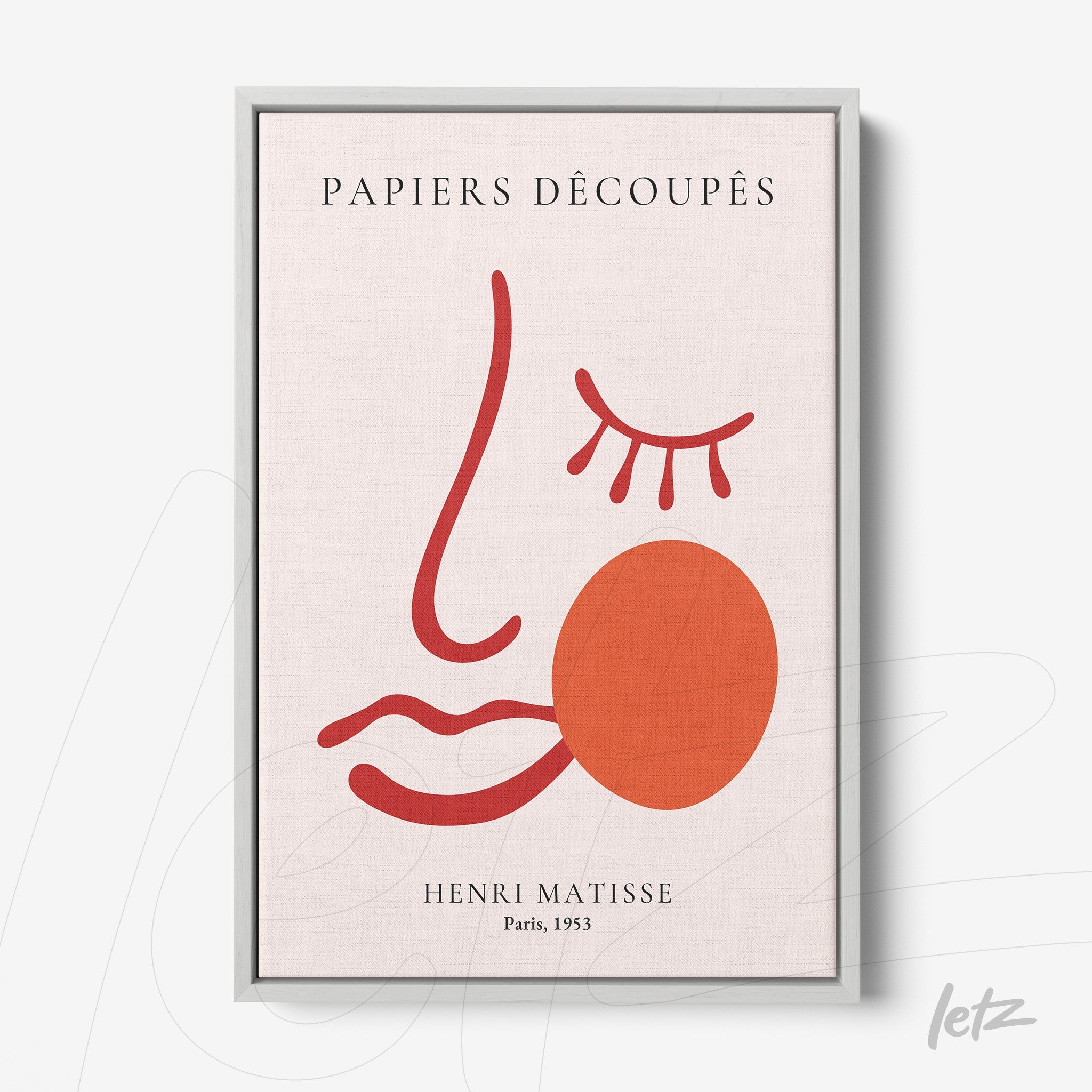 framed wall art featuring minimalist drawing of a face in red and pink tones with silver frame