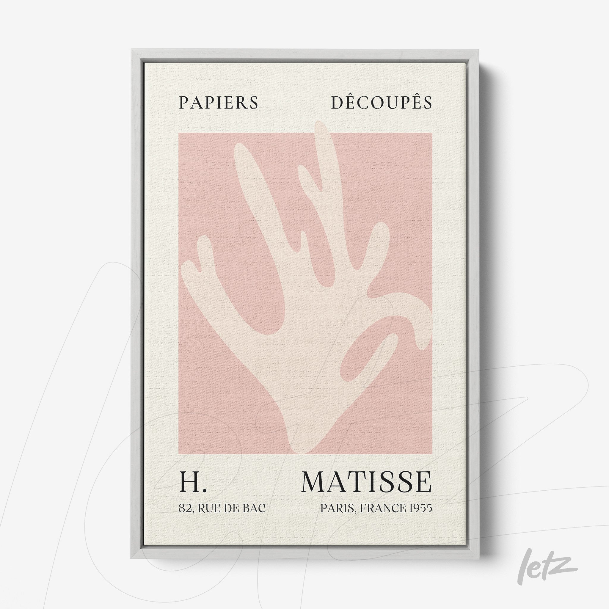 framed wall art featuring an abstract hand design on a light pink background with silver frame