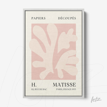 modern art poster featuring paper cutouts in pink background with silver frame