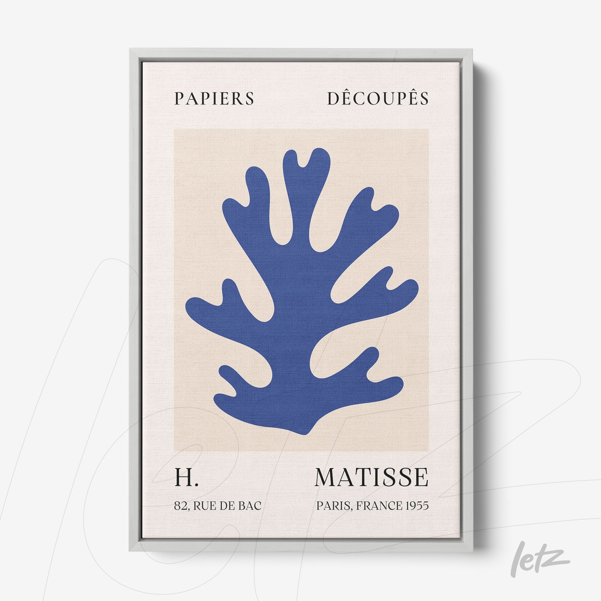 framed abstract artwork in blue tones depicting a stylized coral, with silver frame