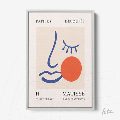 framed artwork featuring abstract line art in vibrant colors, showcasing a stylized female face with a red circle, silver metal frame