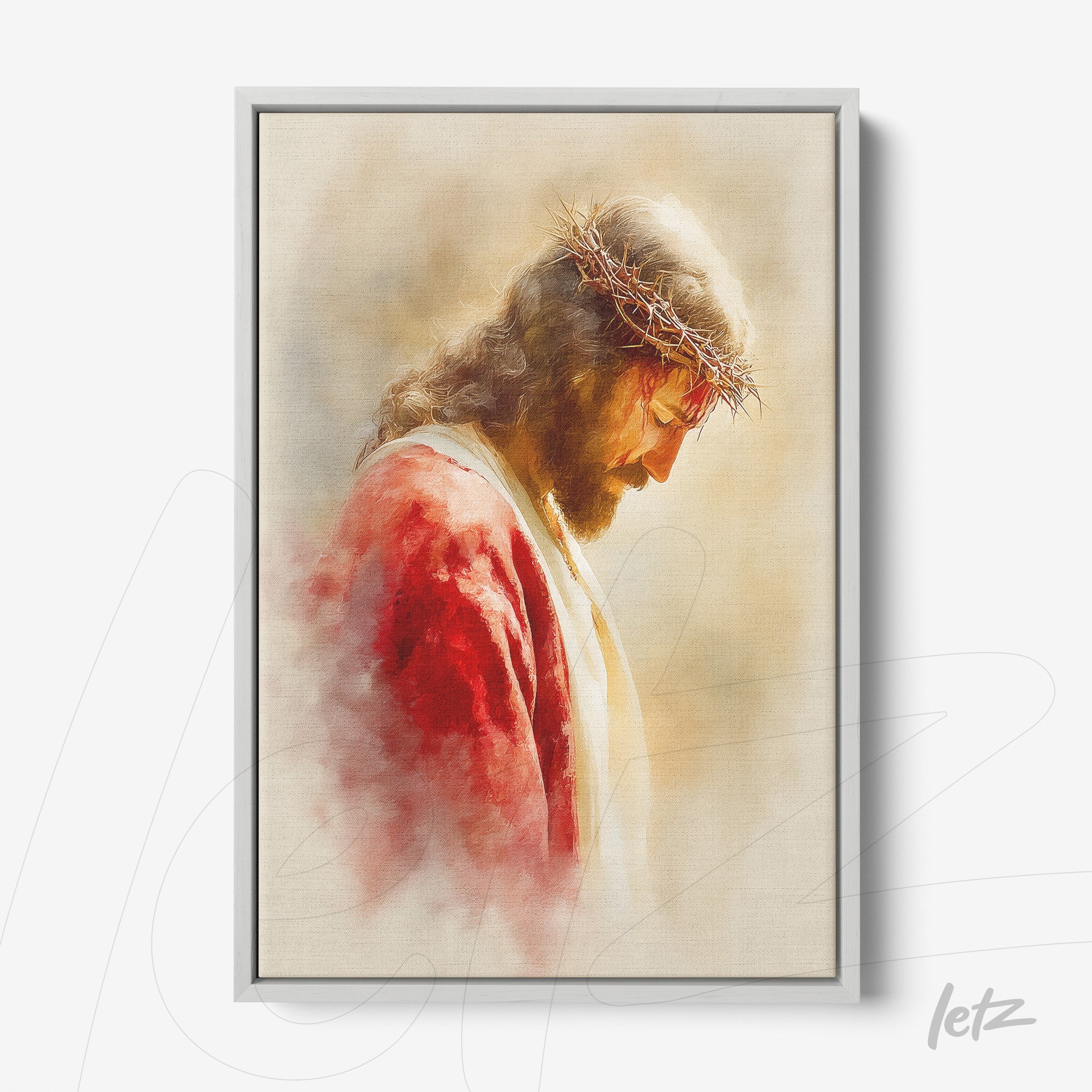 framed portrait of Jesus wearing a crown of thorns with a soft light-colored background and silver frame