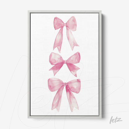 framed artwork featuring watercolor illustration of pink bows arranged vertically