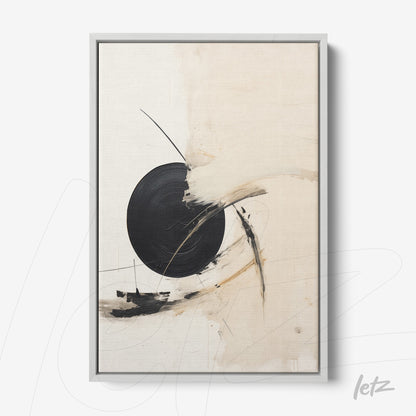 abstract wall art featuring a black circle against a light background in a silver frame