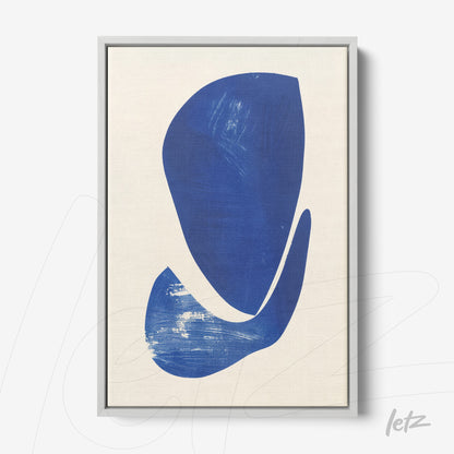 framed wall art featuring abstract shapes in shades of blue on light background with silver frame