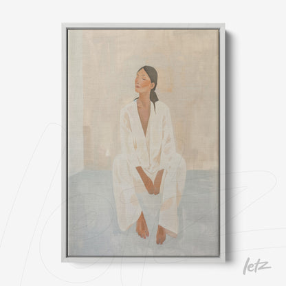 framed minimalist artwork of a seated woman in soft tones with light gray frame