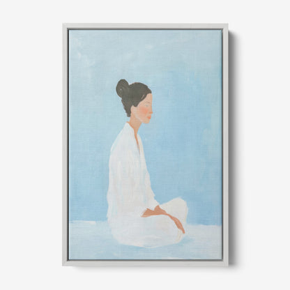 canvas art featuring a portrait of a meditative woman against a light blue background with a gray frame
