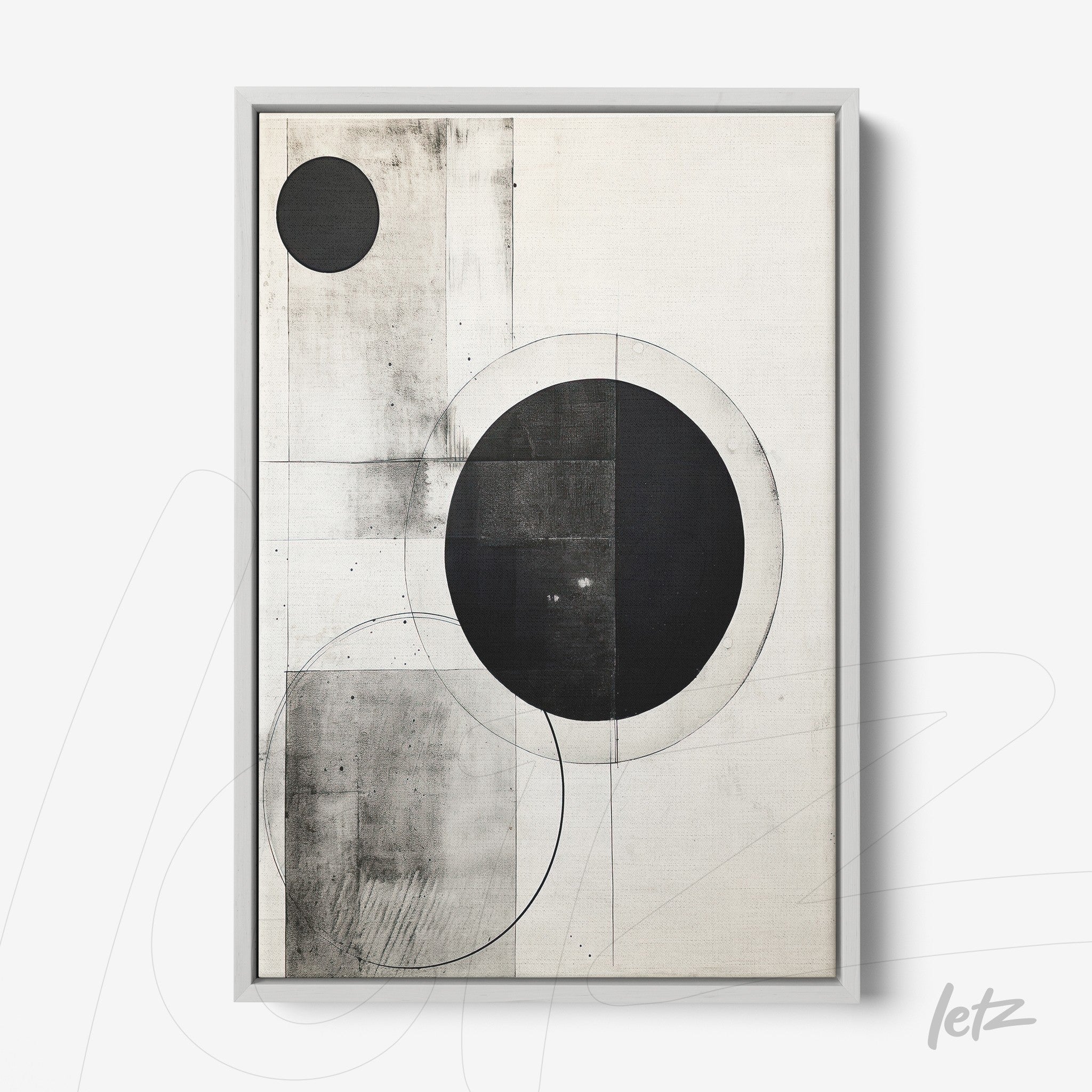 abstract wall art in black and white featuring geometric shapes in silver frame