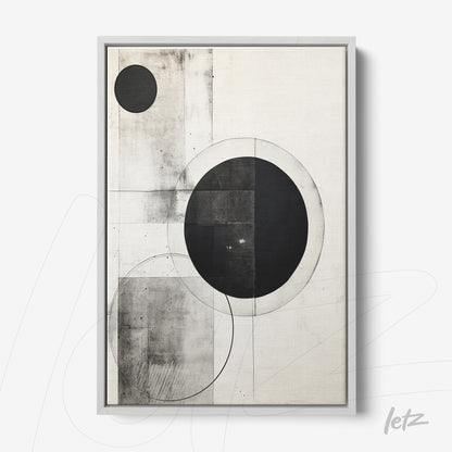 abstract wall art in black and white featuring geometric shapes in silver frame
