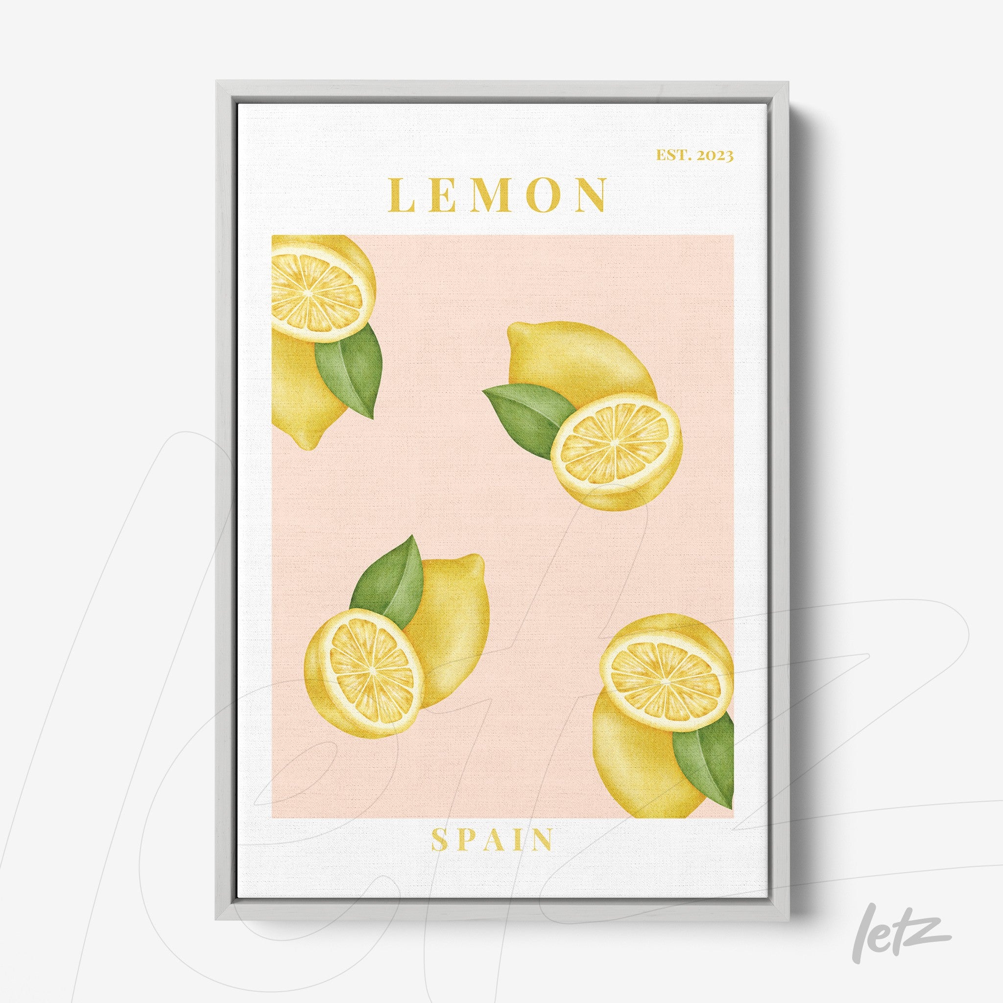 framed wall art featuring lemons on a light pink background with a silver frame