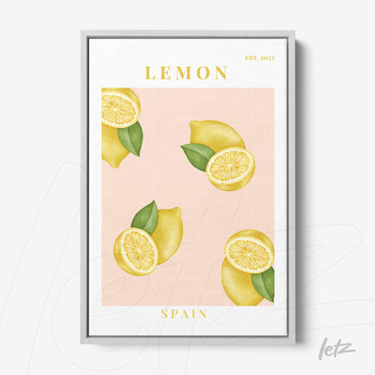 framed wall art featuring lemons on a light pink background with a silver frame