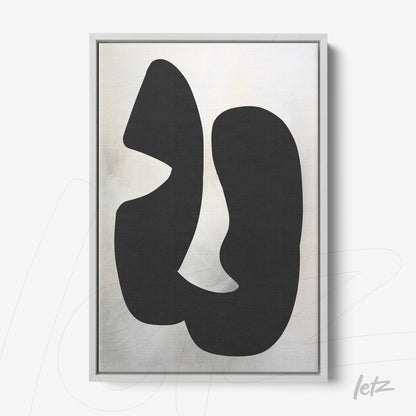 abstract wall art with black shapes on light background, framed in gray