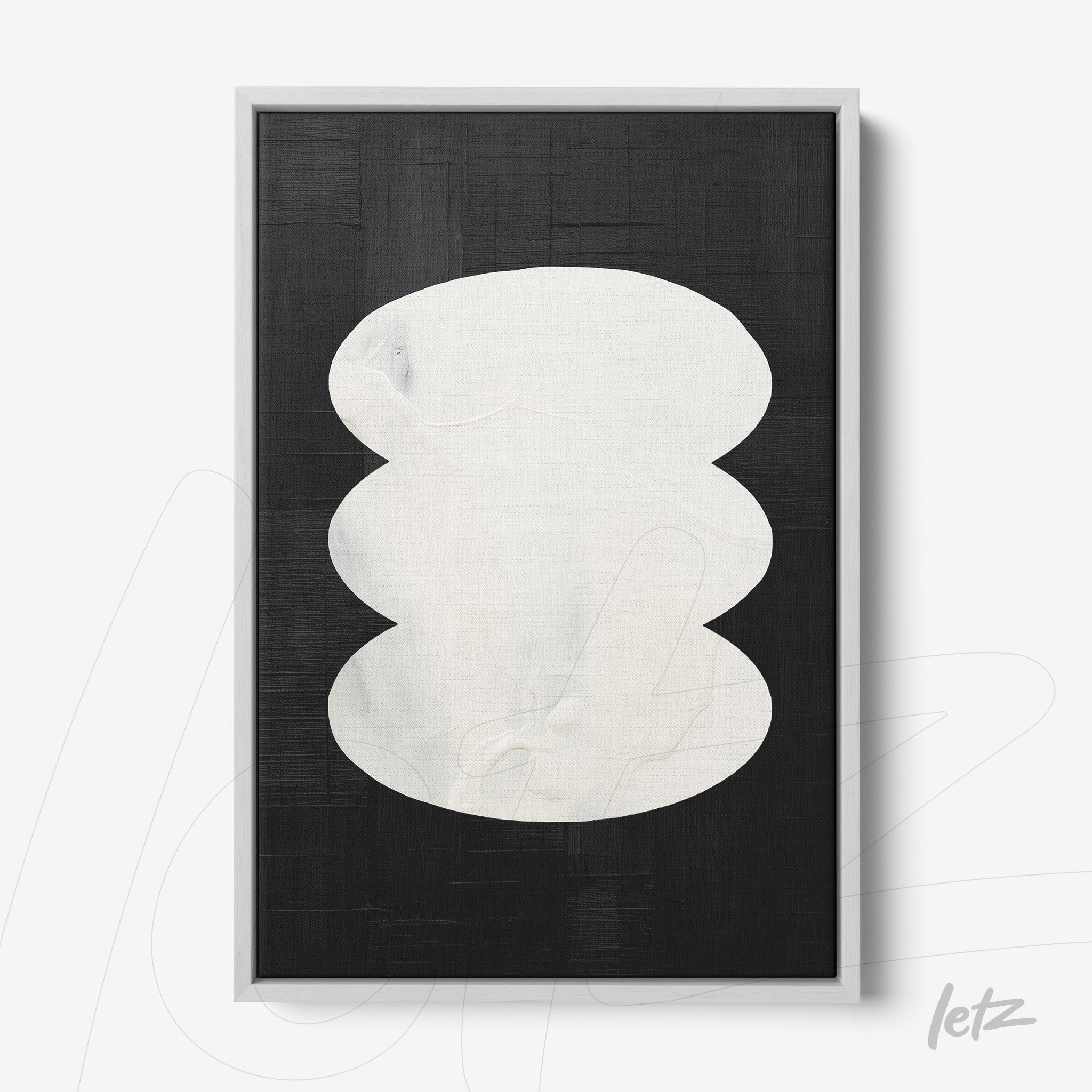 modern wall art featuring black background and white organic shapes framed in light color