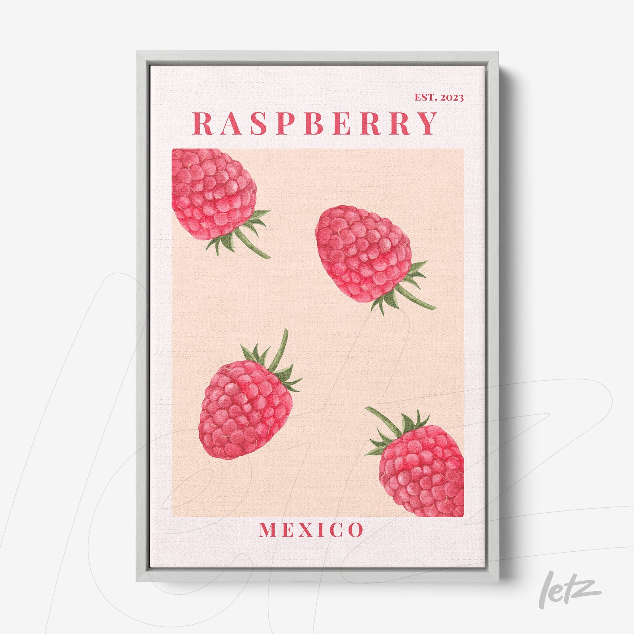 framed wall art featuring raspberries on a light background with a silver frame