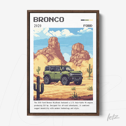 pixel art framed illustration of the 2020 Ford Bronco parked in a desert setting with cacti and mountains in the background, dark brown frame