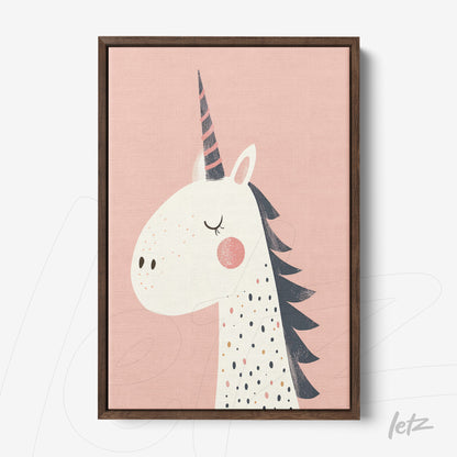 framed wall art featuring a unicorn illustration on a pink background with a dark wood frame